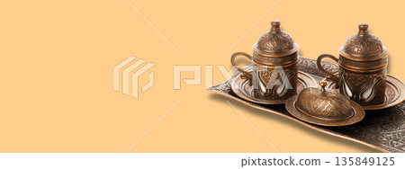 Traditional copper coffee set displayed elegantly for Ramadan Traditional copper coffee set displayed elegantly for Ramadan 135849125