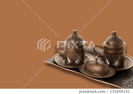 Traditional cups and a decorative tray create a festive setting 135849141