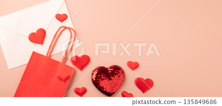 Valentine's day hearts, bag, and envelope on pink background Valentine's day hearts, bag, and envelope on pink background 135849686