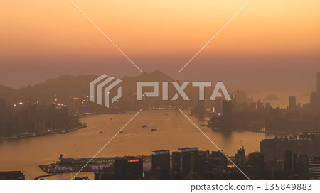 Jan 18 2026 Golden Sunset Descends Behind Hong Kong Skyline And Mountains Jan 18 2026 Golden Sunset Descends Behind Hong Kong Skyline And Mountains 135849883
