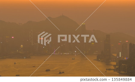 Jan 18 2026 Golden sunset illuminating Hong Kong iconic Victoria Harbour Jan 18 2026 Golden sunset illuminating Hong Kong iconic Victoria Harbour 135849884