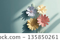 Colorful paper flowers casting shadows on pastel background create serene and artistic composition. delicate petals and soft hues evoke sense of tranquility and creativity 135850261