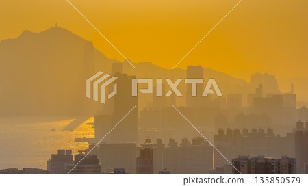 Jan 18 2026 Golden sunset illuminating Hong Kong iconic Victoria Harbour Jan 18 2026 Golden sunset illuminating Hong Kong iconic Victoria Harbour 135850579