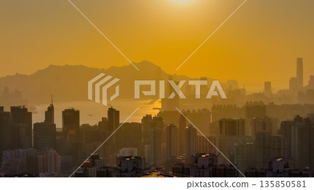 Jan 18 2026 Golden sunset illuminating Hong Kong iconic Victoria Harbour 135850581