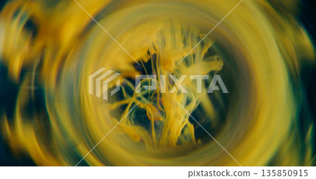 Smoke defocused vortex. Art fume. Yellow bright paint drop curl spilling in fluid. Round lens abstract tunnel color on black background. Smoke defocused vortex. Art fume. Yellow bright paint drop curl spilling in fluid. Round lens abstract tunnel color on black background. 135850915