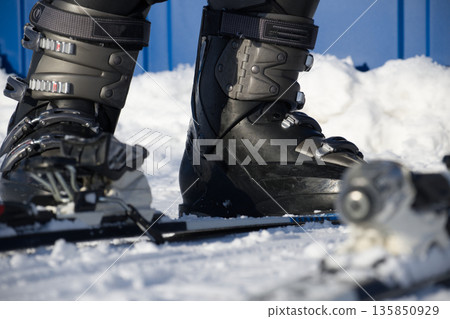 Close Up Of Ski Boots With Bindings On Snow For Winter Sports Photography Close Up Of Ski Boots With Bindings On Snow For Winter Sports Photography 135850929