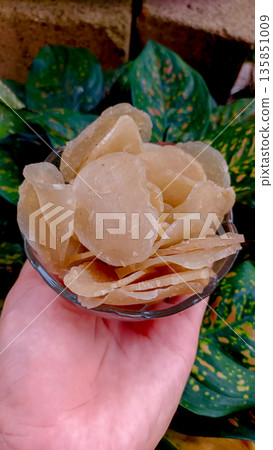 Authentic Raw Fish Chips Kemplang Mentah in Bowl with Green Foliage Authentic Raw Fish Chips Kemplang Mentah in Bowl with Green Foliage 135851009