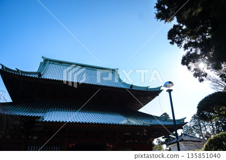 A beautiful silhouette of Japanese temple architecture and overlapping roofs under the blue sky A beautiful silhouette of Japanese temple architecture and overlapping roofs under the blue sky 135851040