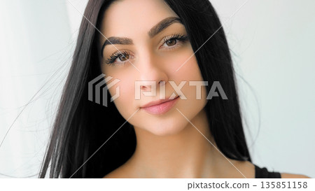 Pretty woman face. Confident model. Beautiful girl with long healthy hair casual makeup. Attractive female isolated on white background. 135851158