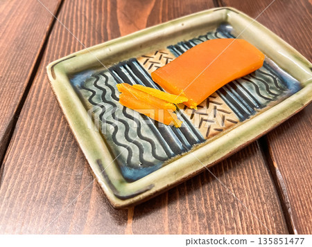 Salted dried mullet roe is a high-class delicacy. 135851477