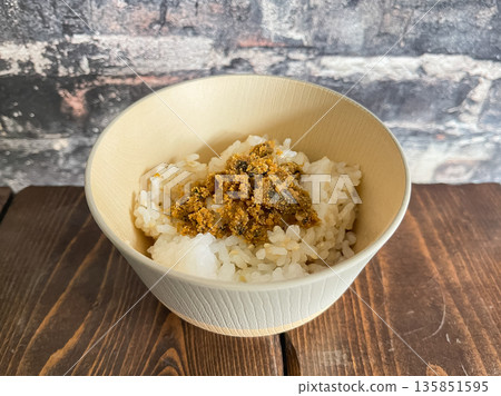 Karasumi chazuke is a dish of seasoned dried mullet roe and rice poured over dashi. 135851595