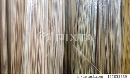 Natural Bamboo Skewers or Wooden Sticks Wrapped in Transparent Plastic Packaging 135853889