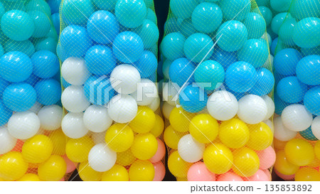 Bags of Colorful Plastic Pit Balls in Blue White and Yellow for Kids Play Area Bags of Colorful Plastic Pit Balls in Blue White and Yellow for Kids Play Area 135853892