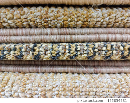 Stack of Various Textured Carpet Samples in Earth Tones Stack of Various Textured Carpet Samples in Earth Tones 135854381