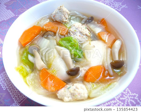 Chicken dumpling soup with rice cakes 135854423