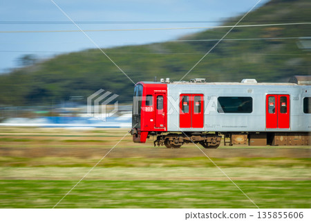 A train running through the middle of a field A train running through the middle of a field 135855606