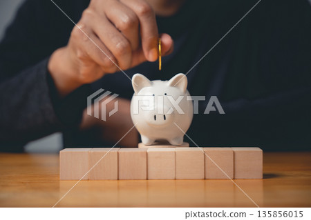 A closeup of a man hand pose making a gesture as a sign of saving money, a positive sign for financial planning, investment and building wealth for the future A closeup of a man hand pose making a gesture as a sign of saving money, a positive sign for financial planning, investment and building wealth for the future 135856015