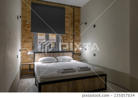 Private double room in a loft hostel with warm bedside lighting 135857834