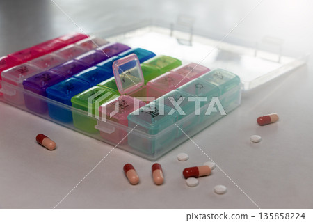 pill set box on table for daily medication 135858224