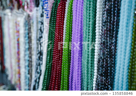 Beads and Colorful Strands of Jewelry on Display. High quality photo Beads and Colorful Strands of Jewelry on Display. High quality photo 135858846