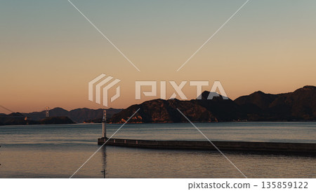 Dawn at the harbor lined with oyster rafts 135859122