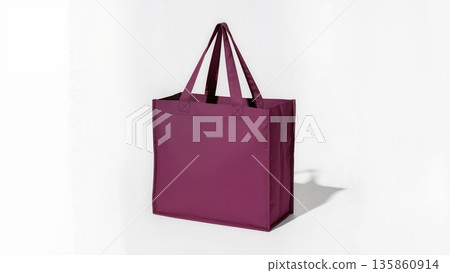 Deep red shopping bag with leather handles, isolated on pure white surface, studio lighting, crisp details, commercial e-commerce display style. 135860914