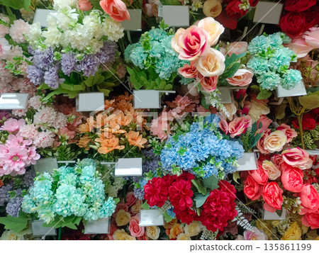 Variety of Colorful Artificial Silk Flowers and Floral Arrangements for Interior Home Decoration Variety of Colorful Artificial Silk Flowers and Floral Arrangements for Interior Home Decoration 135861199