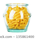 Raw pasta Fusilli in a glass jar isolated on white background. 135861400