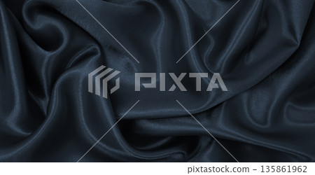 Smooth elegant dark grey silk or satin luxury cloth texture as abstract background. Luxurious background design Smooth elegant dark grey silk or satin luxury cloth texture as abstract background. Luxurious background design 135861962
