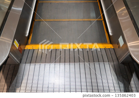 Shopping mall, escalator, moving escalator, escalator Shopping mall, escalator, moving escalator, escalator 135862403