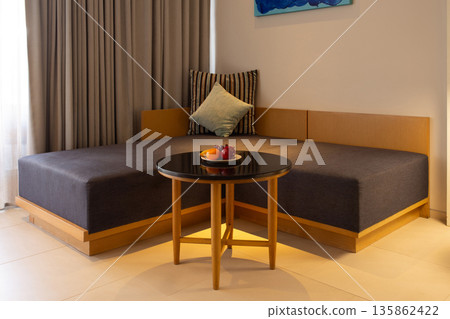 Welcoming Living Room with Fresh Fruit for Guests 135862422