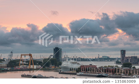 Aerial timelapse of Maashaven harbour during sunset in Rotterdam, The Netherlands 135863009