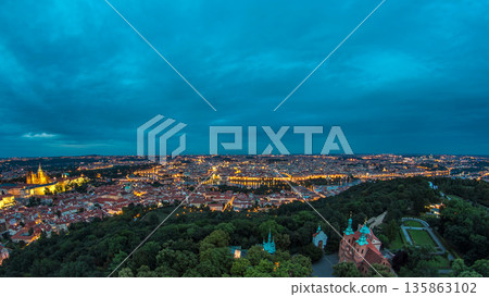 Wonderful day to night timelapse View To The City Of Prague From Petrin Observation Tower In Czech Republic Wonderful day to night timelapse View To The City Of Prague From Petrin Observation Tower In Czech Republic 135863102