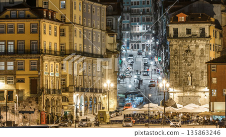 Traditional quaint houses in the old, vintage and touristic ribeira district of Porto at night timelapse, Portugal 135863246