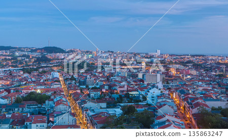 Rooftops of Porto's old town on a warm spring evening timelapse day to night, Porto, Portugal 135863247