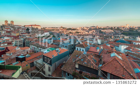 Sunset time, shadow covering Douro riverside with the Dom Luiz bridge timelapse, Porto , Portugal. 135863272