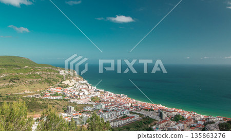Aerial view on the coastal town of Sesimbra in Portugal timelapse 135863276