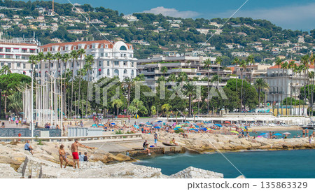 Colorful old town and beach in Cannes timelapse on french Riviera in a beautiful summer day, France Colorful old town and beach in Cannes timelapse on french Riviera in a beautiful summer day, France 135863329