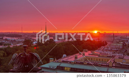 Sunrise over historic center from the colonnade of St. Isaac's Cathedral timelapse. 135863379