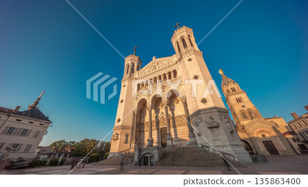 Hyperlapse front view of the Basilica of Notre Dame de Fourviere during sunset in Lyon, France. 135863400