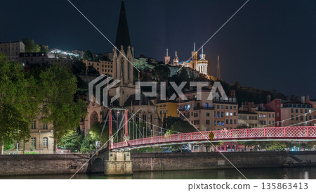 Timelapse hyperlapse of Saint George Church at night, Quais de Saone and Fourviere Basilica from a footbridge in Vieux Lyon, France 135863413