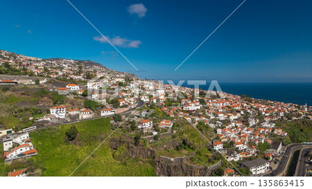 Aerial view from the mountain over the rooftops from cable car on Madeira timelapse hyperlapse. 135863415