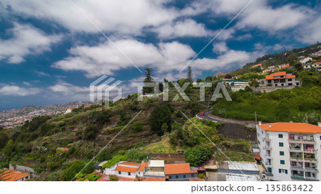 View from the mountain over the rooftops from cable car on Madeira timelapse hyperlapse. View from the mountain over the rooftops from cable car on Madeira timelapse hyperlapse. 135863422