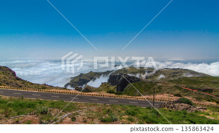 View over the clouds from slopes of Pico do Arieiro, Madeira timelapse 135863424