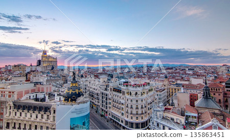 Panoramic aerial view of Gran Via timelapse before sunset, Skyline Old Town Cityscape, Metropolis Building, capital of Spain 135863451