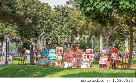 Miraflores central park timelapse. Place for relax with green trees and lawn in Peruvian capital. Lima, Peru Miraflores central park timelapse. Place for relax with green trees and lawn in Peruvian capital. Lima, Peru 135863556