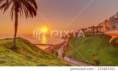Aerial sunset view of Lima's Coastline in the neighborhood of Miraflores timelapse, Lima, Peru 135863561