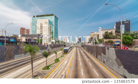 Aerial view of Via Expresa highway and metropolitan bus with traffic timelapse hyperlapse and blue sky with clouds. Lima, Peru Aerial view of Via Expresa highway and metropolitan bus with traffic timelapse hyperlapse and blue sky with clouds. Lima, Peru 135863579