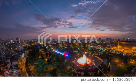 Aerial view to Park of the Reserve with magic water circuit biggest fountain complex day to night timelapse Aerial view to Park of the Reserve with magic water circuit biggest fountain complex day to night timelapse 135863594
