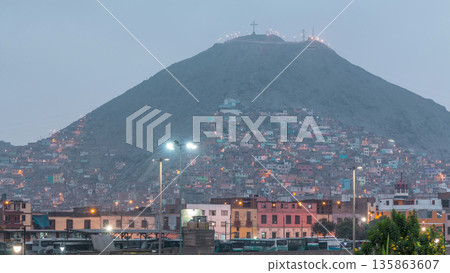 Slums on the slope of hill San Cristobal on the northern side of the river Rimac day to night timelapse. Lima, Peru Slums on the slope of hill San Cristobal on the northern side of the river Rimac day to night timelapse. Lima, Peru 135863607